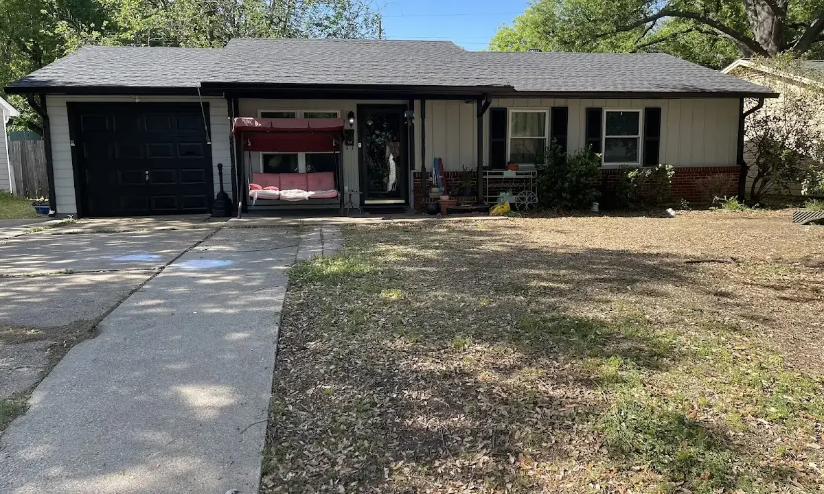 Asphalt Shingle Roof Repair crew at work on a residential roof in Clute